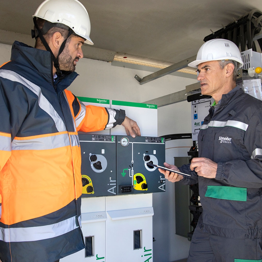 Two field service engineers discussing with each other